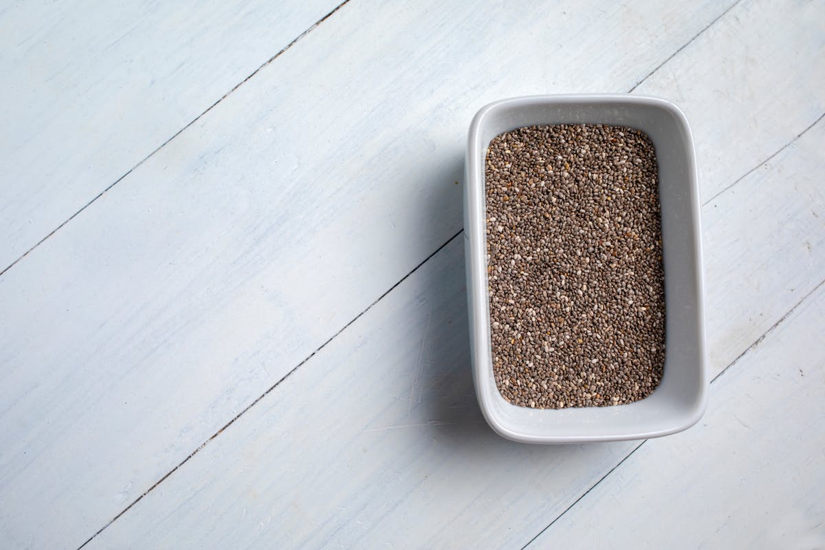 Chia seeds in a bowl on a light background