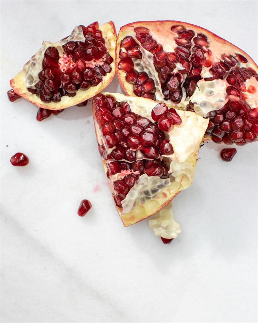 Opened pomegranate on a light background